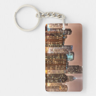 Snow falls over skyline at evening in Chicago Key Ring