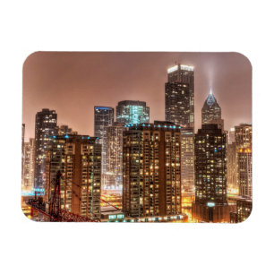 Snow falls over skyline at evening in Chicago Magnet