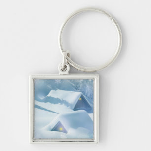 Snow topped roof in a forest key ring