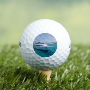 Snow-white yacht  near the White Island in Red Sea Golf Balls