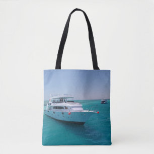 Snow-white yacht near the White Island in Red Sea Tote Bag