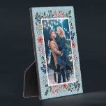 Snow Winter Floral Christmas Photo Plaque<br><div class="desc">Tabletop built-in photo easel features your favourite photo surrounded by snow and winter flowers - poinsettias, berries and leaves - on ANY COLOR BACKGROUND (we show blue.) Change the YEAR (in the lower right corner) or it can be deleted. Great as a gift or to display your favourite photo in...</div>