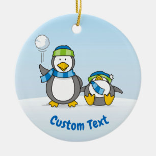 Snowballing penguins ceramic ornament