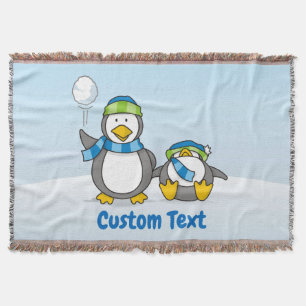 Snowballing penguins throw blanket