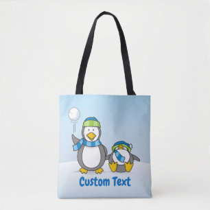 Snowballing penguins tote bag