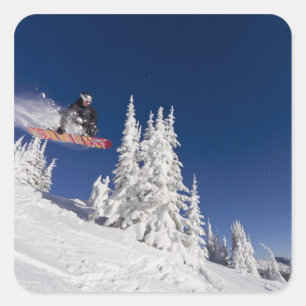 Snowboarding action at Whitefish Mountain Resort Square Sticker