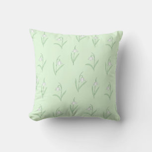 Snowdrops on green background cushion