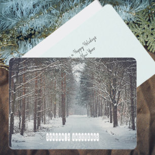 Snowfall in the winter forest holiday card
