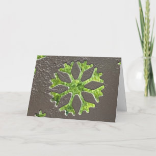 Snowflake cut into steel card