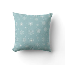 Snowflake pattern on blue background throw pillow