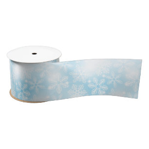 Snowflakes and lights on blue satin ribbon
