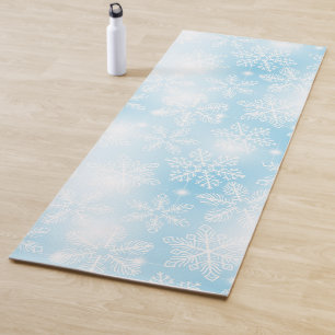Snowflakes and lights on blue yoga mat