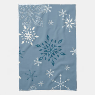 Snowflakes on a blue background tea towel
