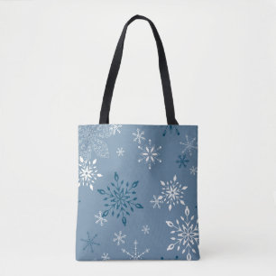 Snowflakes on a blue background tote bag