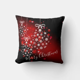 Snowflakes on a red and black background. cushion