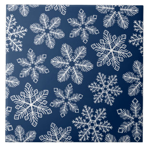 Snowflakes on dark blue ceramic tile