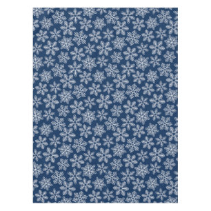 Snowflakes on dark blue tablecloth