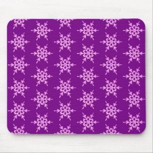Snowflakes, pale orchid crystals on purple mouse pad