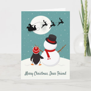 Snowman and Penguin Watch Santa’s Sleigh Holiday Card