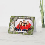 Snowman and Pine On Barnwood Photo Christmas Holiday Card<br><div class="desc">Rustic Christmas design features a barnwood background with pine branch trim all around. On the left hand side is a cute snowman graphic. To the right is a place to add your photo on what looks like a piece of paper tacked to the wood. Above the photo is customisable text...</div>