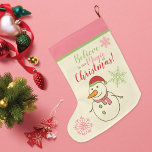 Snowman Believe in Magic Large Christmas Stocking<br><div class="desc">A cute Christmas stocking to hang from the mantel of a snowman with a santa hat and carrot nose in pink,  red and green with the phrase - Believe in the Magic of Christmas!</div>