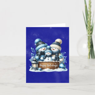 Snowman family dressed for christmas holiday card