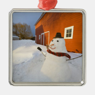 Snowman in front of red barn in Columbia Falls Metal Ornament