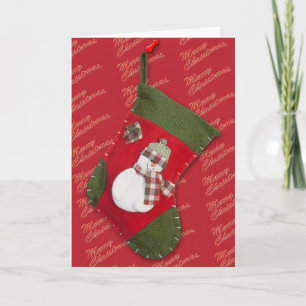 Snowman on Christmas Stocking Over Red Holiday Card