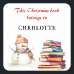 Snowman This Christmas Book Belongs To Custom Name Square Sticker<br><div class="desc">Inspire the wonder of reading this Christmas, with this charming bookplate sticker. The words are 'This Christmas book belongs to' in red script typography, followed by the recipient's name (click 'Personalise' to enter the name you would like). The festive sticker is decorated with a watercolor-style picture of a snowman with...</div>