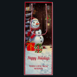 Snowman Vintage Christmas Scene  Wine Gift Bag<br><div class="desc">This is an adorable Christmas gift bag featuring a Christmas scene of a snowman with gifts at the front door of a house in a vintage watercolor style. The text on the gift bag is customisable with your own.</div>