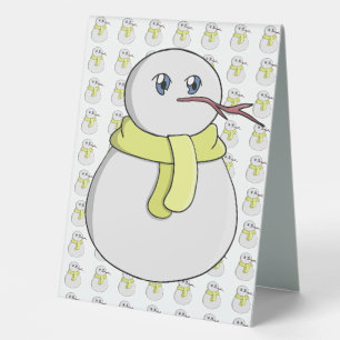 Snowman wearing a yellow scarf