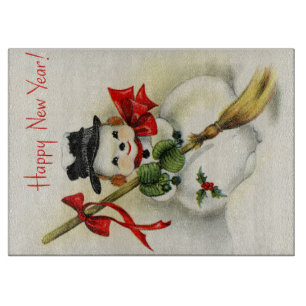 Snowman with a broom wishing Happy New Year Cutting Board