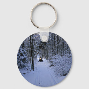 Snowmobiling after fresh snowfall Winter Key Ring