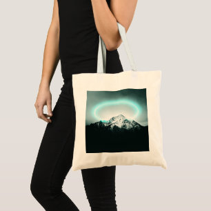 Snowy mountain mysterious blue neon light tote bag
