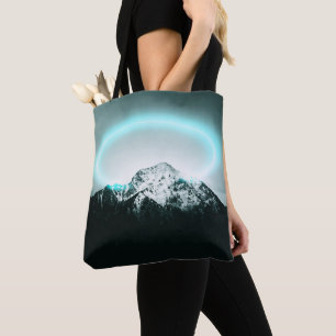 Snowy mountain mysterious blue neon light tote bag
