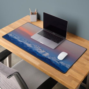 Snowy mountains with magical sky desk mat