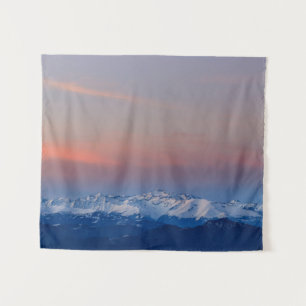 Snowy mountains with magical sky tapestry