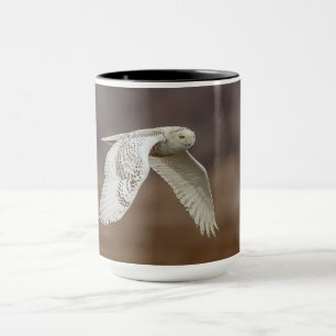 Snowy owl in flight mug