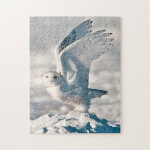 Snowy Owl taking off from snow Jigsaw Puzzle