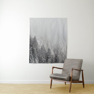 Snowy spruce forest wrapped in fog tapestry