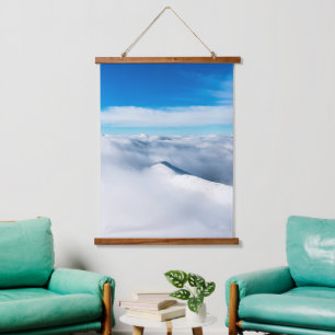 Snowy winter mountain wrapped in clouds hanging tapestry