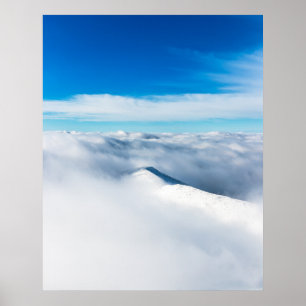 Snowy winter mountain wrapped in clouds poster
