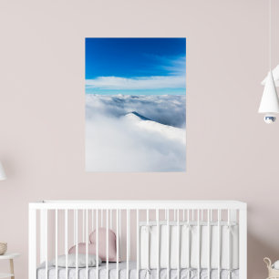Snowy winter mountain wrapped in clouds poster