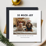So Much Joy Christmas Funny Baby Dog Photo Blue Holiday Card<br><div class="desc">Spread happiness with the "So Much Joy Christmas" funny baby dog photo holiday card! This card features a cute baby and an adorable dog, bringing lots of smiles. It's a perfect way to share your baby's first Christmas and is budget-friendly, making it easy to send joy to friends and family...</div>
