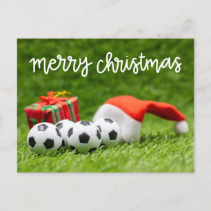 Soccer ball on green grass for Christmas Holiday