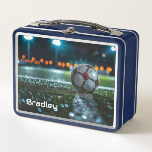 Soccer ball on the empty wet arena pitch metal lunch box