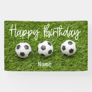 Soccer ball with Happy Birthday sign on green
