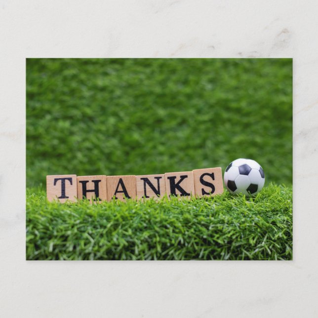 Soccer ball with Thanks word are on green grass Postcard (Front)