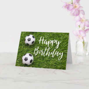 Soccer ball with word Happy Birthday on green Card