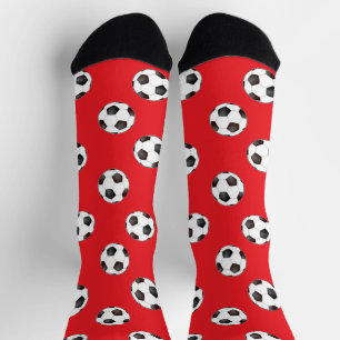 Soccer balls on red socks
